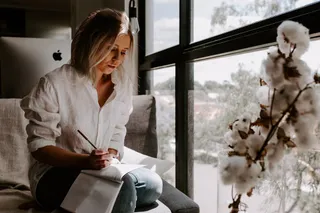 Woman white shirt writing
