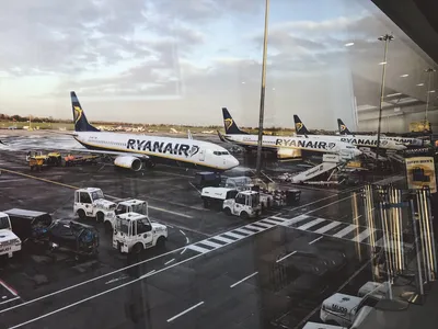 A photo from inside the airport of a Ryanair plane