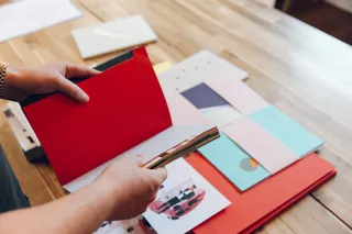 Andy chooses some paper samples