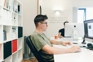 Side view of mike at his desk