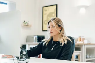 Kirsty concentrating at her desk