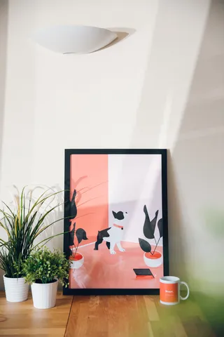 Close up view of a MadeByShape mug and print