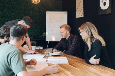 Close up of the MadeByShape team looking at wireframes